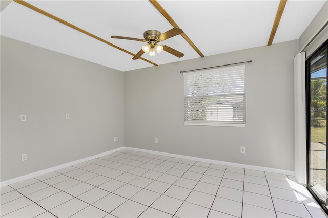 spare room featuring baseboards and ceiling fan