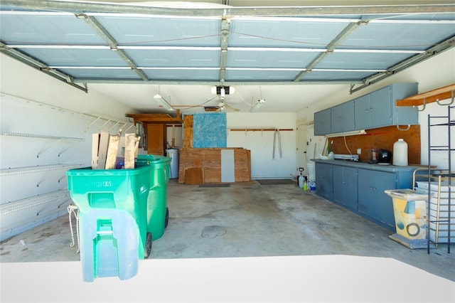 garage with a garage door opener and water heater