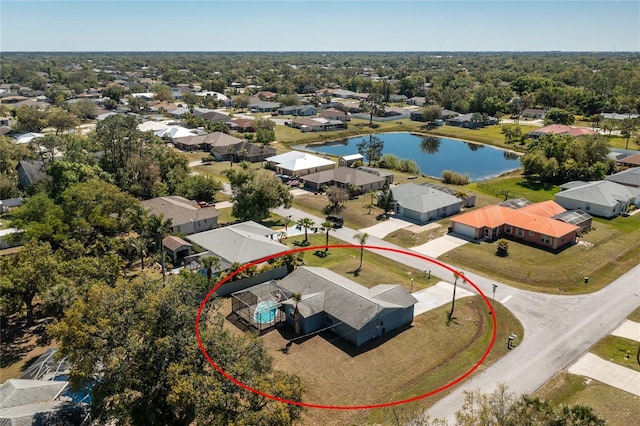 birds eye view of property with a water view and a residential view