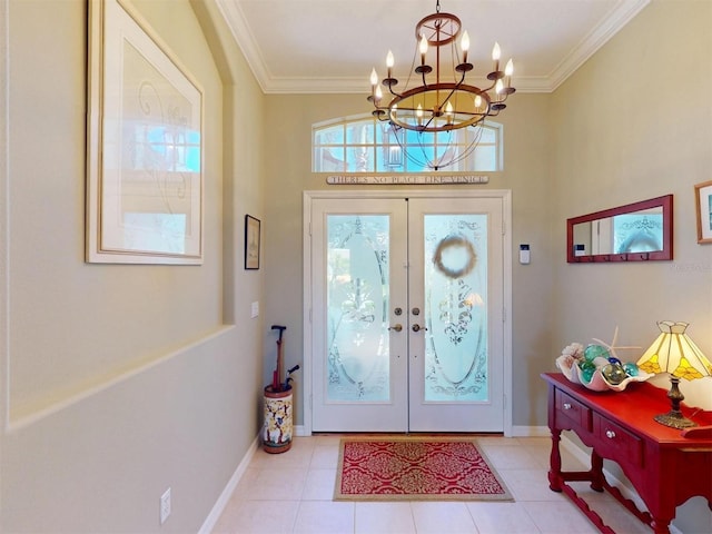 foyer entrance with light tile patterned floors, french doors, baseboards, and ornamental molding