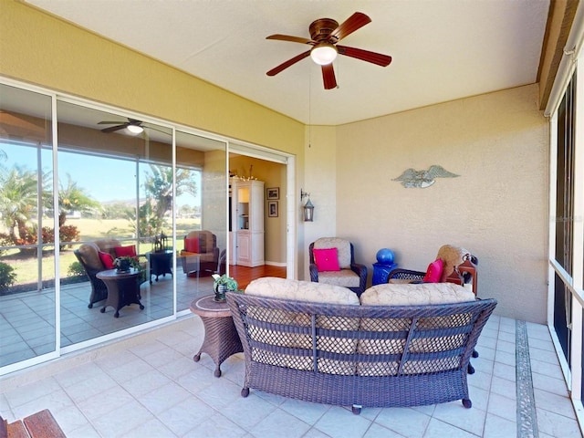 view of patio / terrace with an outdoor living space and a ceiling fan