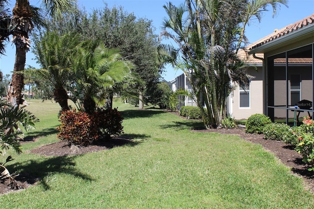 view of yard with a sunroom