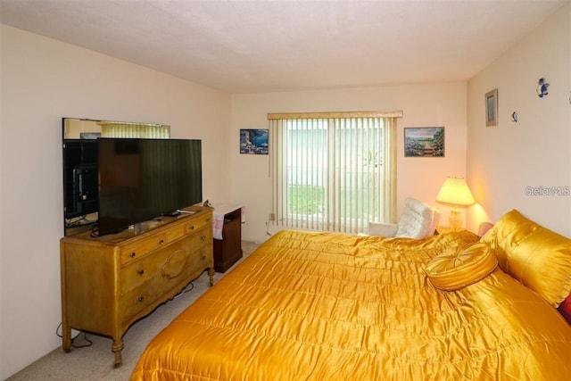 bedroom featuring light carpet