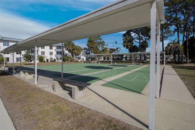 view of property's community with a residential view and shuffleboard