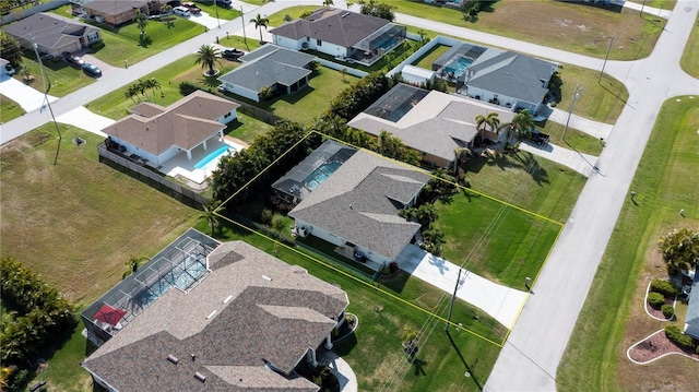 birds eye view of property with a residential view