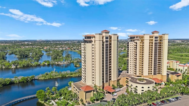 birds eye view of property featuring a city view and a water view