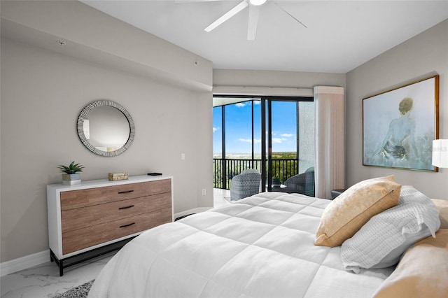 bedroom featuring baseboards, marble finish floor, access to exterior, and a ceiling fan