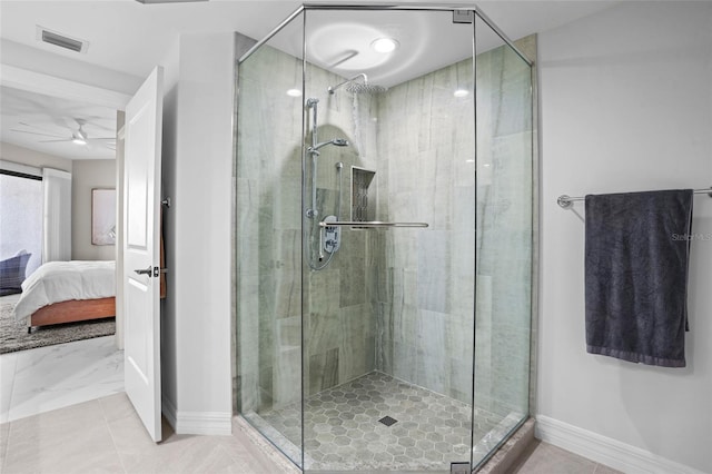 full bathroom with baseboards, visible vents, tile patterned flooring, a shower stall, and ensuite bathroom