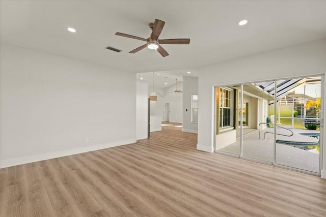 empty room with visible vents, a ceiling fan, wood finished floors, recessed lighting, and baseboards