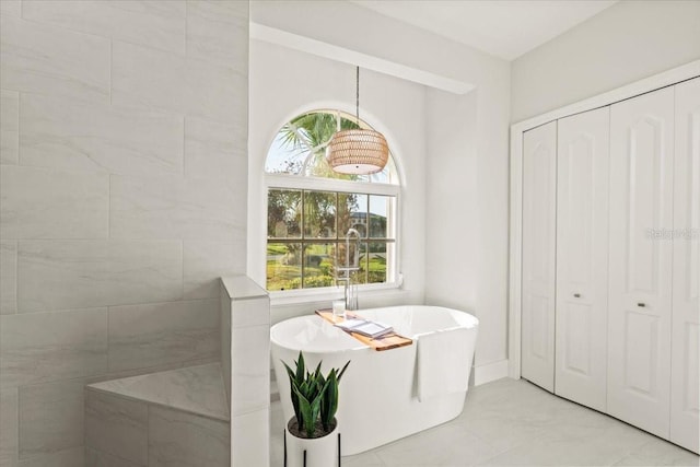 bathroom with a soaking tub