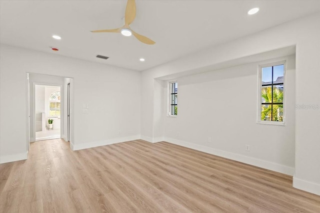 unfurnished room featuring visible vents, a ceiling fan, recessed lighting, light wood finished floors, and baseboards