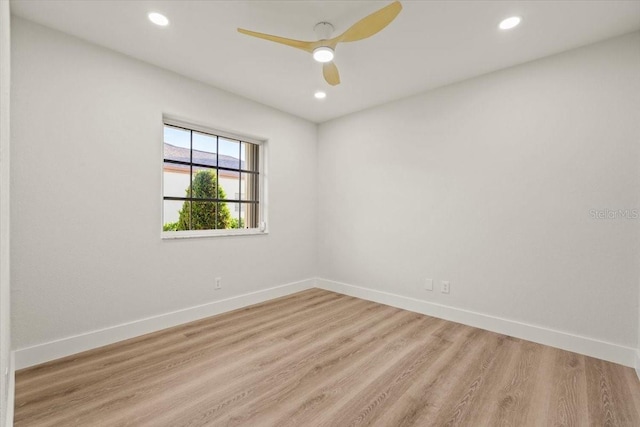 unfurnished room with recessed lighting, light wood-style flooring, baseboards, and a ceiling fan