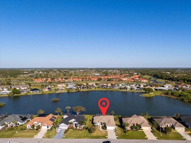 birds eye view of property with a residential view and a water view