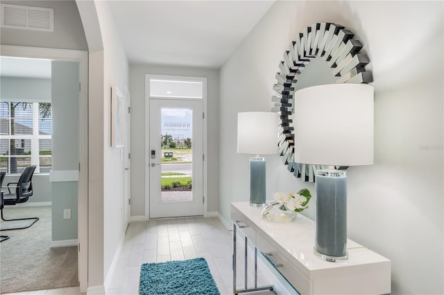 entryway with visible vents and baseboards