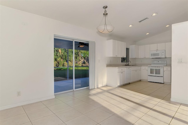 kitchen featuring light countertops, hanging light fixtures, white cabinets, white appliances, and a sink