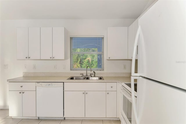 kitchen featuring a sink, white appliances, white cabinets, and light countertops