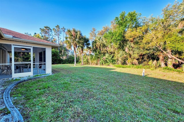 view of yard featuring a sunroom