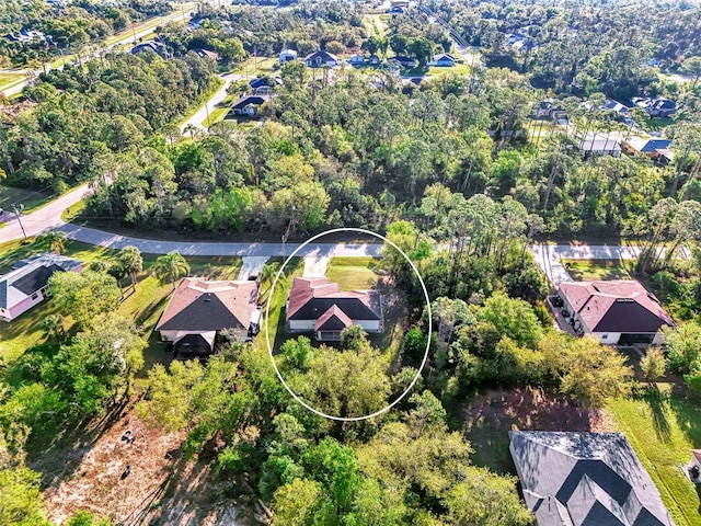 bird's eye view with a view of trees and a residential view