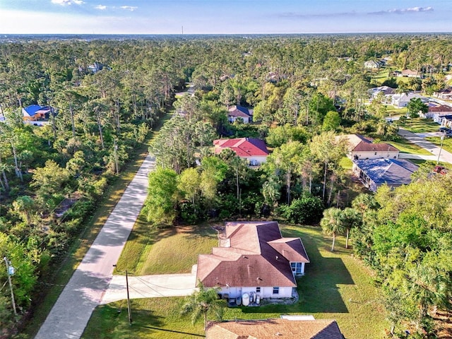 drone / aerial view featuring a view of trees