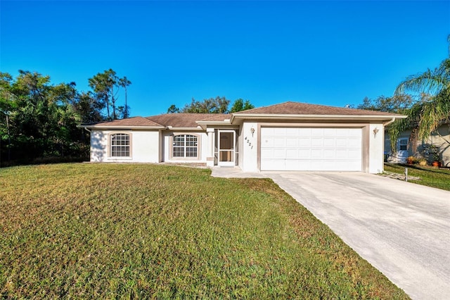 ranch-style home with stucco siding, an attached garage, driveway, and a front lawn