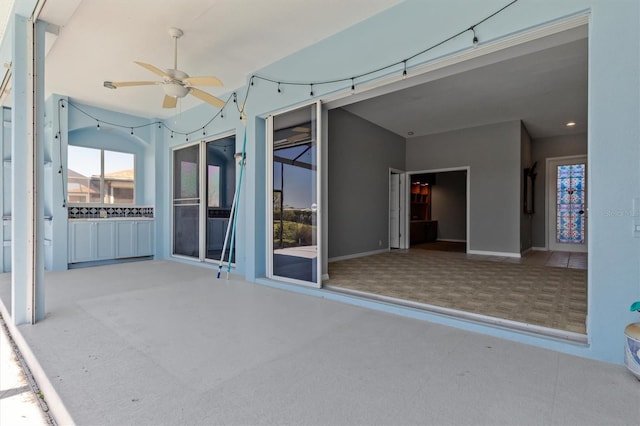 view of patio / terrace featuring a ceiling fan