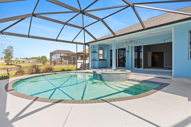 view of swimming pool with glass enclosure, a patio, and a pool with connected hot tub