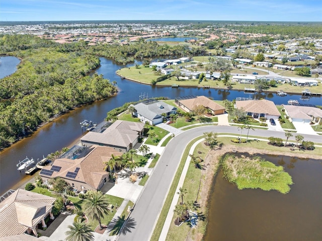 aerial view with a residential view and a water view