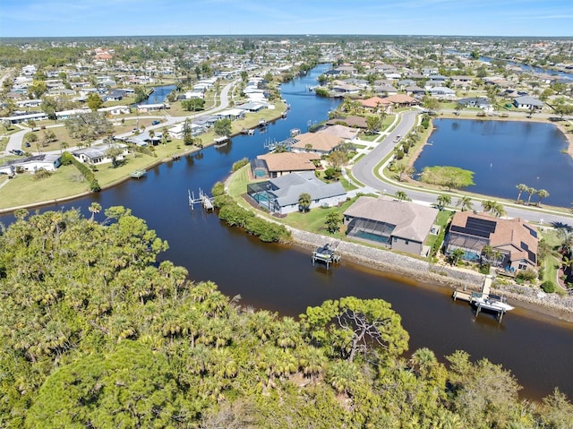 bird's eye view featuring a residential view and a water view