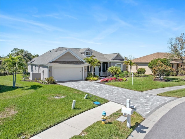 view of front of property with a front lawn, decorative driveway, and a garage