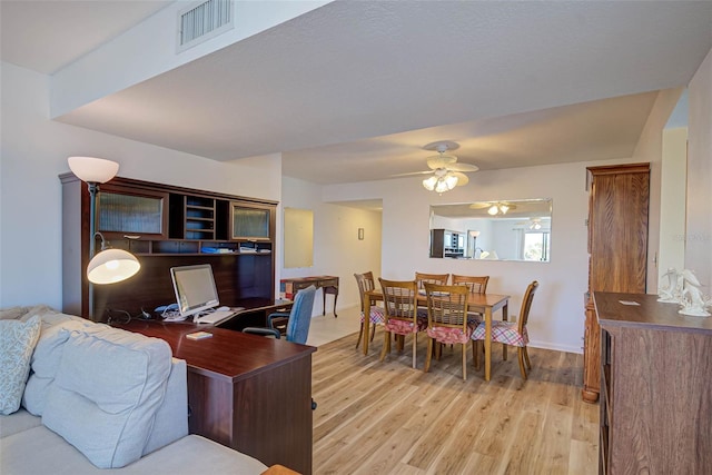 home office featuring visible vents, baseboards, and light wood-style flooring