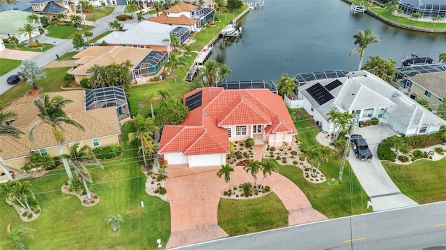 bird's eye view featuring a residential view and a water view