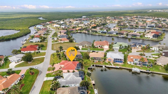 bird's eye view with a residential view and a water view