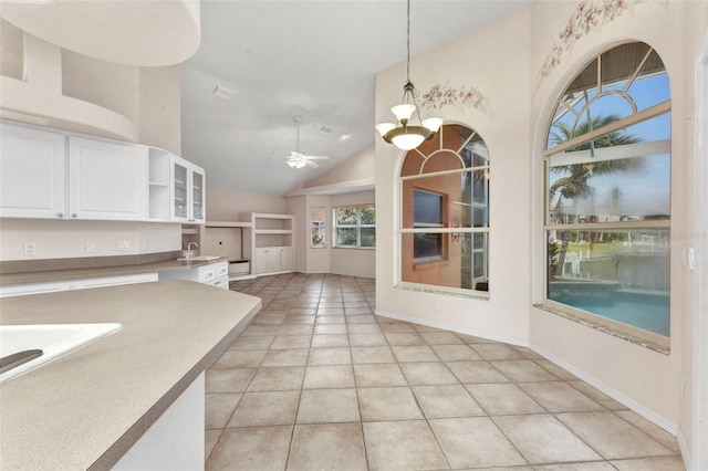 kitchen featuring a sink, decorative light fixtures, light tile patterned flooring, white cabinetry, and open shelves