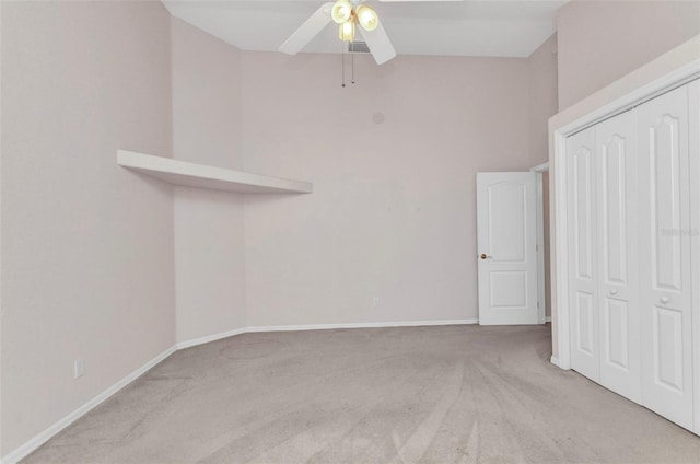 unfurnished room featuring a ceiling fan, baseboards, and carpet floors