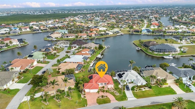 aerial view with a residential view and a water view