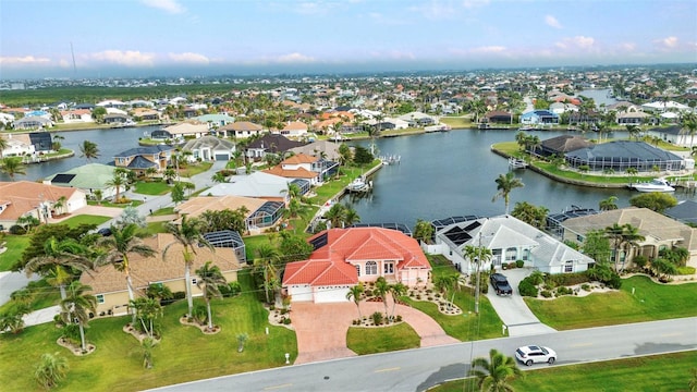 bird's eye view with a residential view and a water view