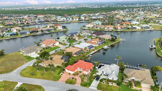 aerial view featuring a residential view and a water view