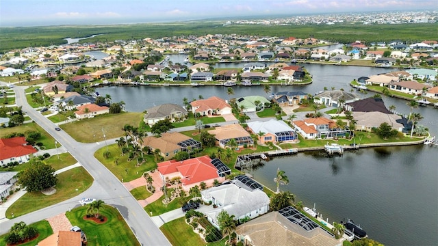 bird's eye view with a residential view and a water view