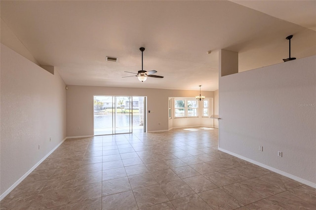 spare room featuring visible vents, baseboards, lofted ceiling, light tile patterned flooring, and ceiling fan with notable chandelier