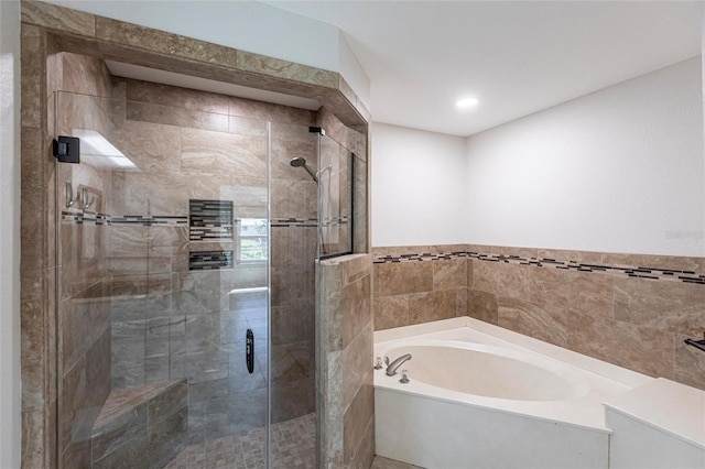 bathroom with a garden tub and a stall shower