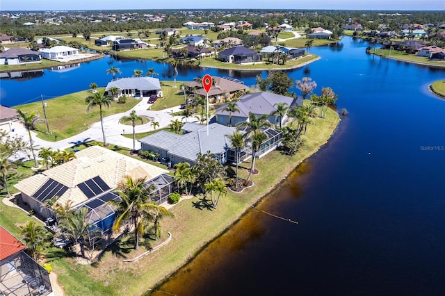 aerial view with a residential view and a water view