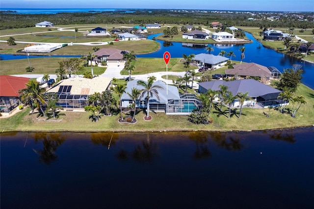 bird's eye view featuring a residential view and a water view