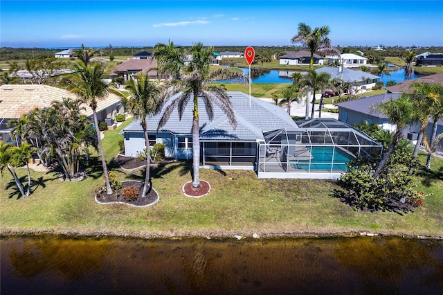 drone / aerial view with a residential view and a water view