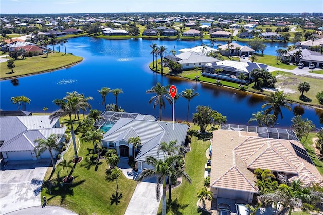 birds eye view of property with a residential view and a water view