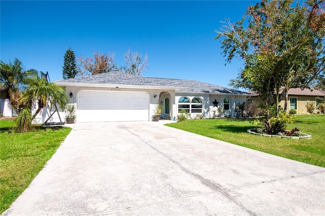 single story home with stucco siding, an attached garage, concrete driveway, and a front yard