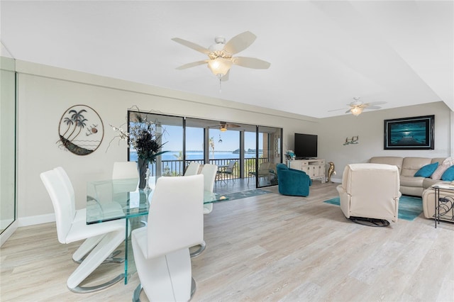 dining area featuring a ceiling fan, wood finished floors, and baseboards