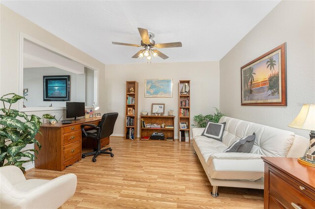 office featuring light wood-type flooring and a ceiling fan