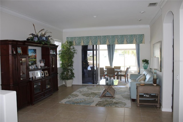 tiled living area with crown molding and visible vents