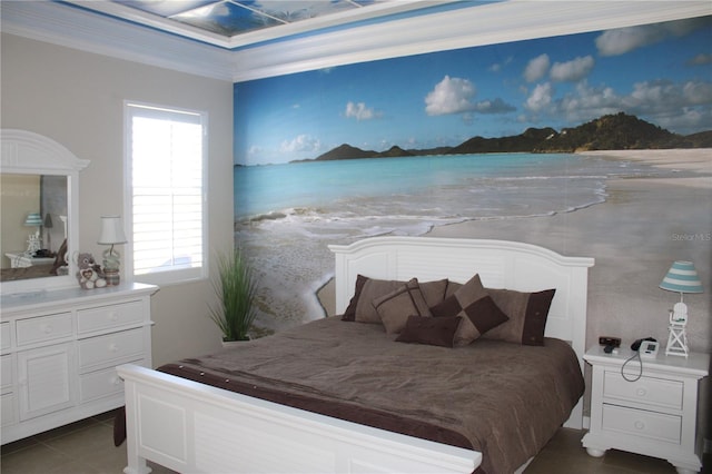 bedroom featuring crown molding and dark tile patterned flooring