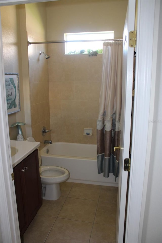 bathroom featuring tile patterned floors, toilet, vanity, and shower / bath combination with curtain